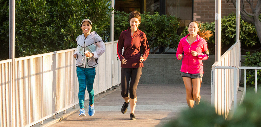 Three women running.