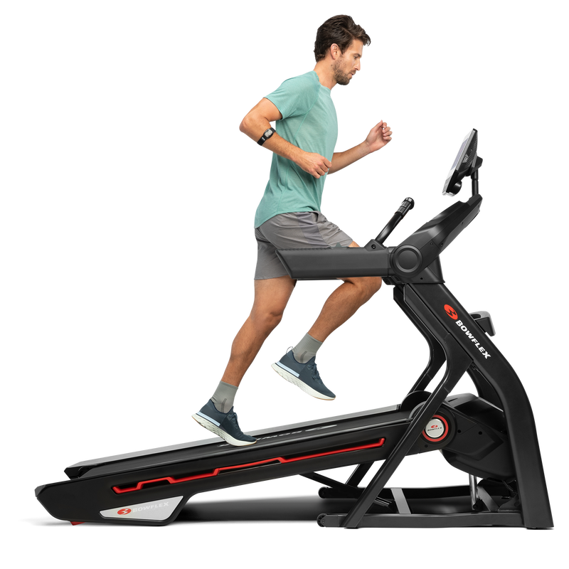 A man using the treadmill 10 in an incline position. - expanded view