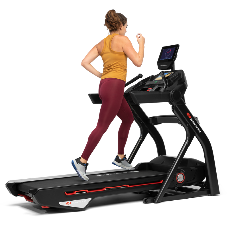 A woman jogging on a treadmill 10. - expanded view