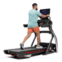 Man using the extended handlebars on the Treadmill 22--thumbnail