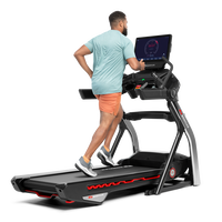 Man using the touchscreen on the Treadmill 22--thumbnail