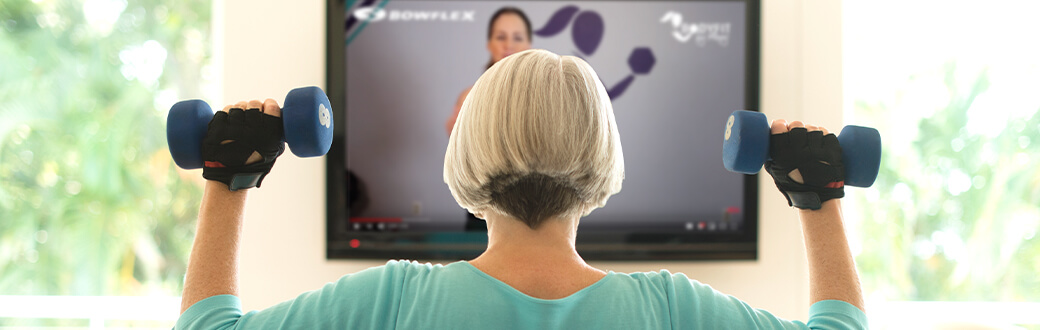 A woman using dumbbells