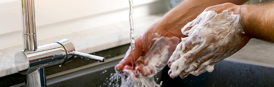 A person washing their hands