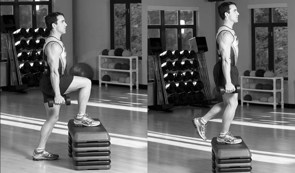 Tom Holland performing a dumbbell bench step-up