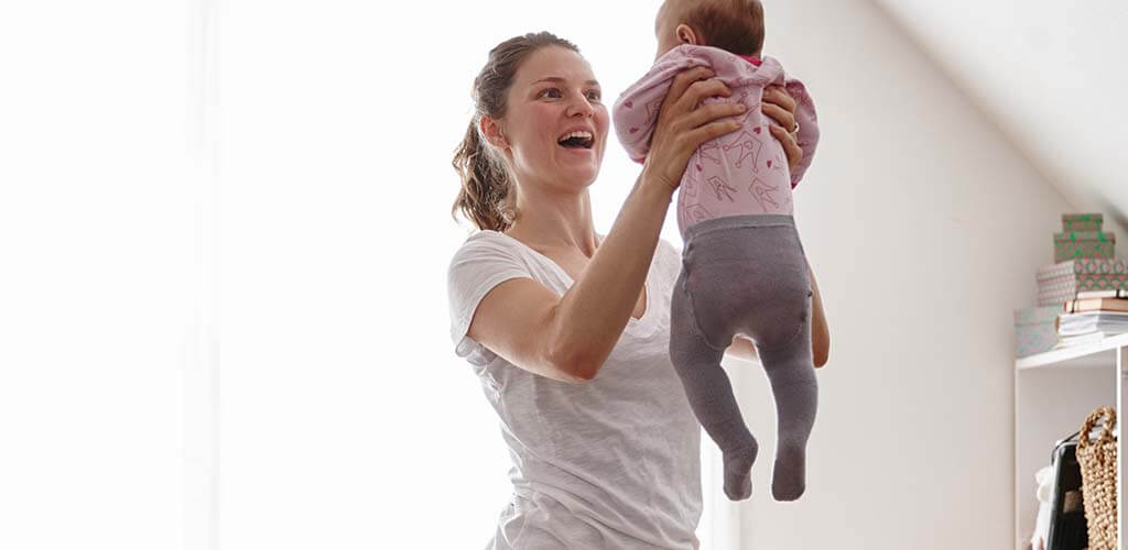 A woman holding a baby