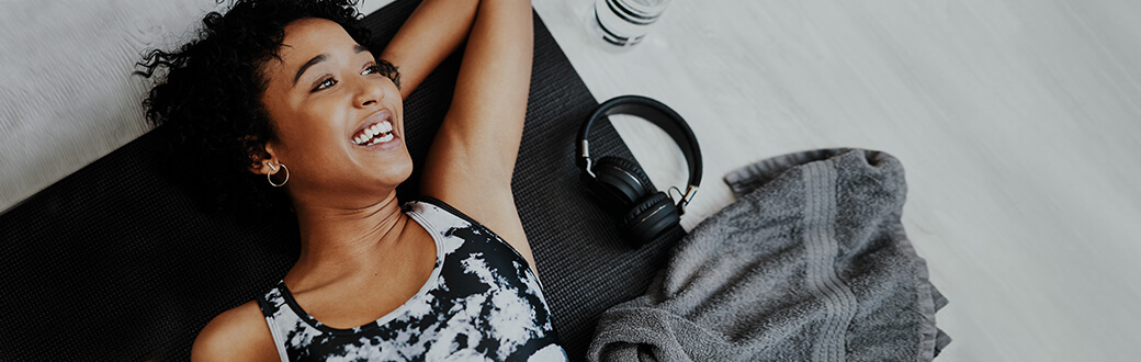 A woman exercising with headphones.