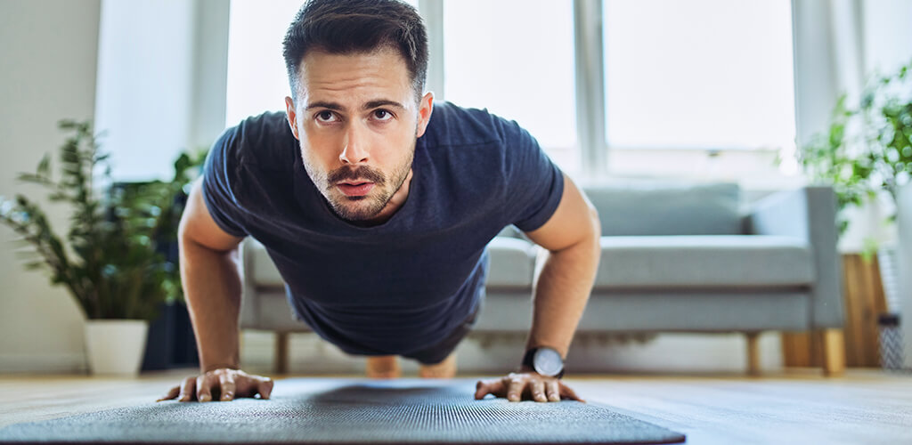 A man performing a push up.