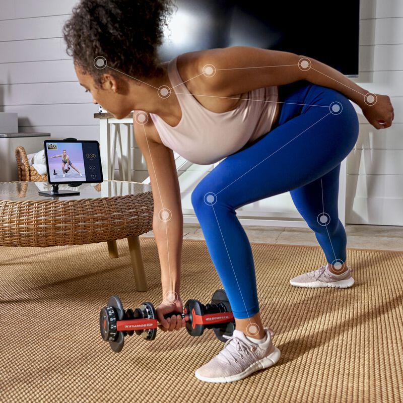 Woman working out with JRNY tablet holder - expanded view