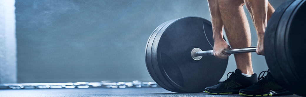 A person performing a deadlift.