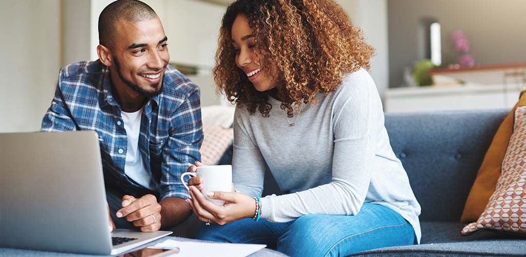 Two people spending time together in their living room.