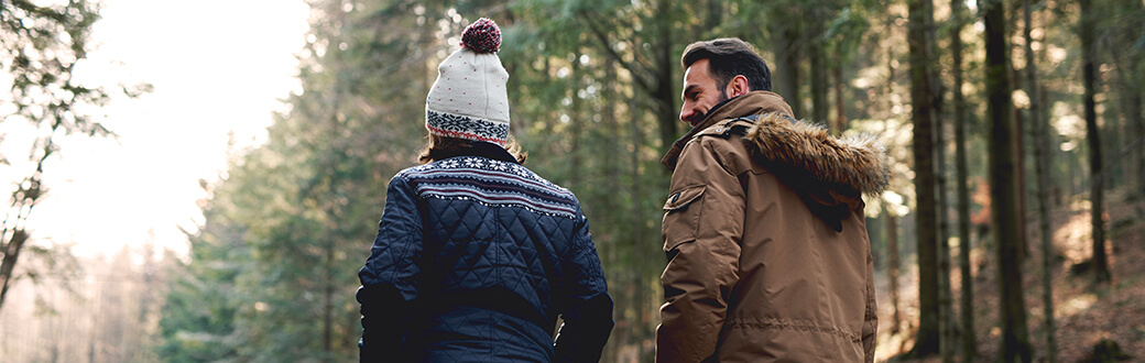 Two people walking outside.