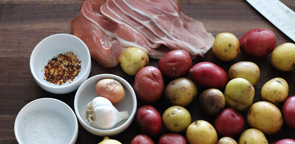 many potatoes on a cutting board