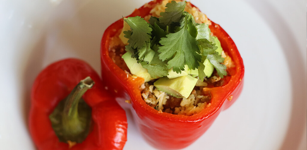 An uncooked stuffed pepper.