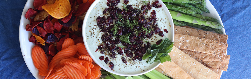 Cranberry yogurt dip served with assorted veggies and crackers.