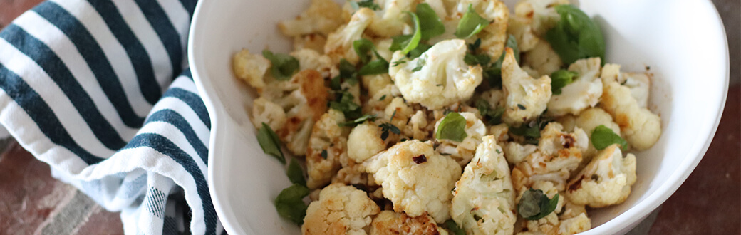 Lemon Herb Roasted Cauliflower in a White Dish