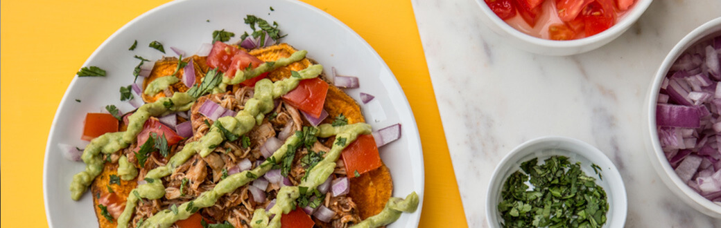 A plate of loaded sweet potato nachos