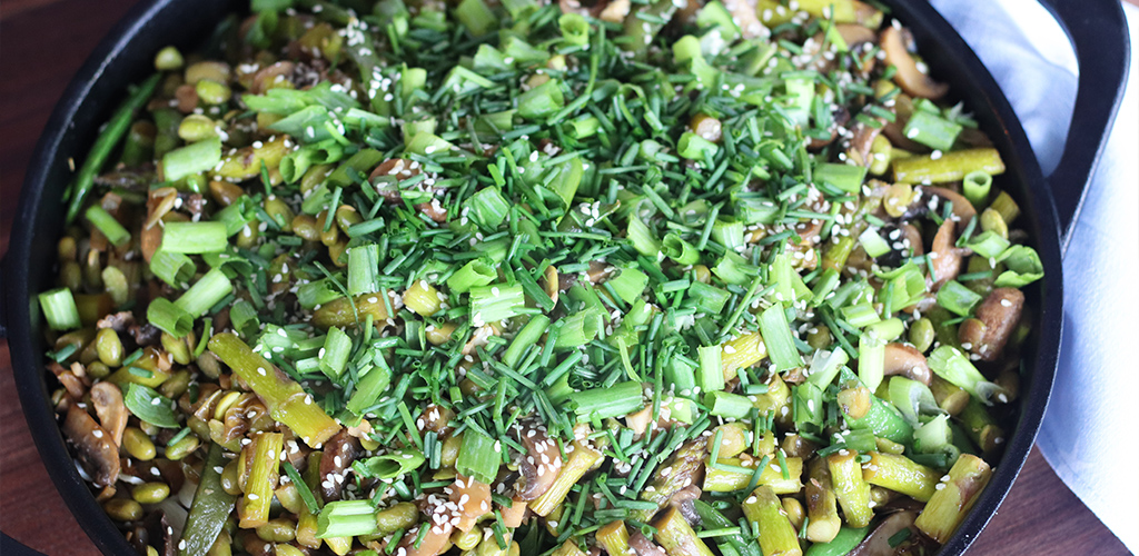 Mushroom, Asparagus, Snap Pea and Edamame Stir Fry in a dish.