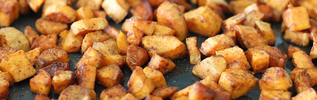 Roasted sweet potatoes on a sheet pan