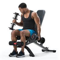 A man using dumbbells on a Bowflex 3.1S Bench.--thumbnail