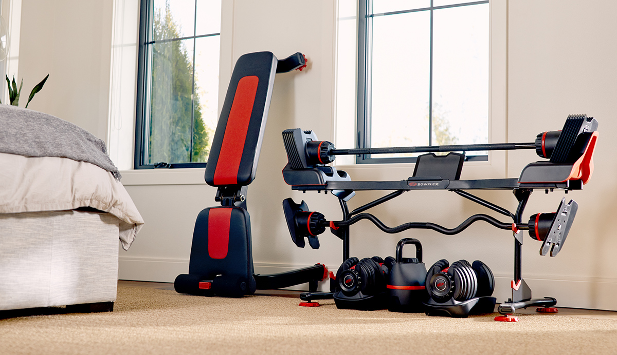 Woman working out on a Max Trainer in her bedroom