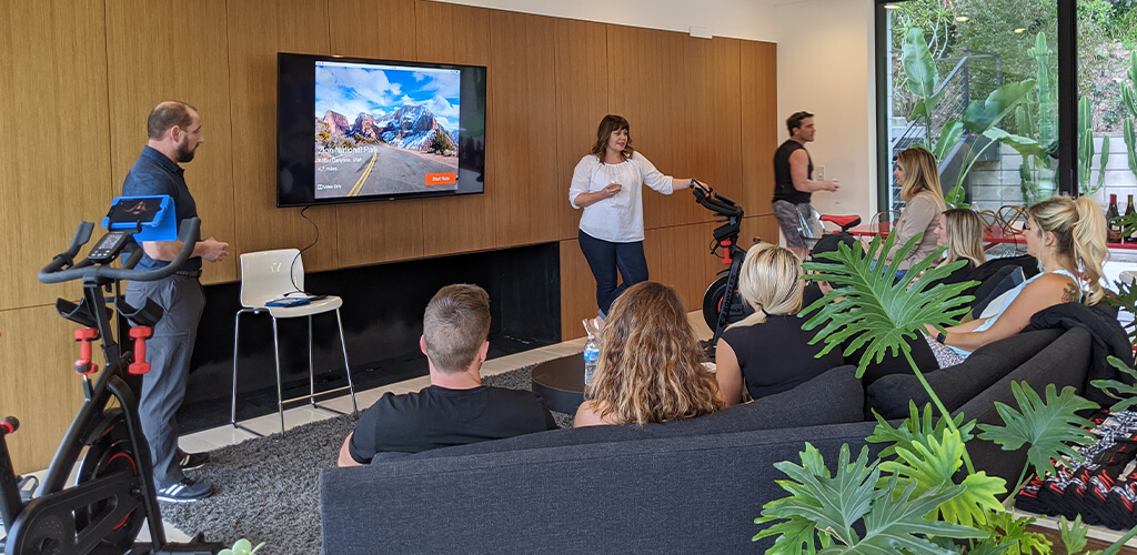 A group of people learning about Bowflex connected fitness.