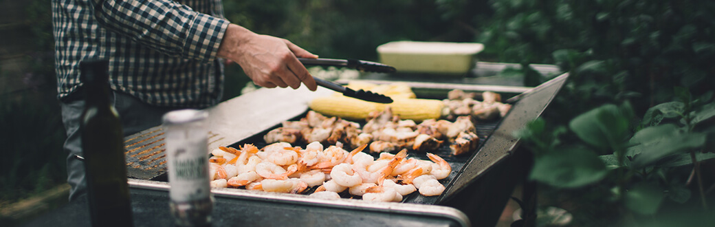 Healthy Grilling Tips. A person grilling.