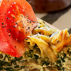 Close up of tomato and spinach pie