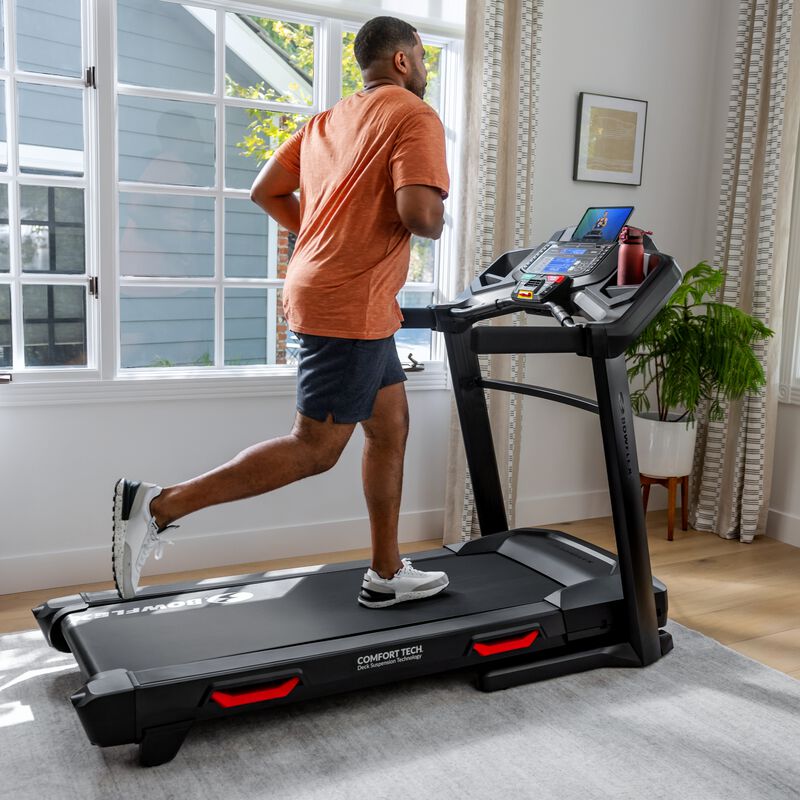 Woman jogging on a Bowflex BXT8J Treadmill - expanded view