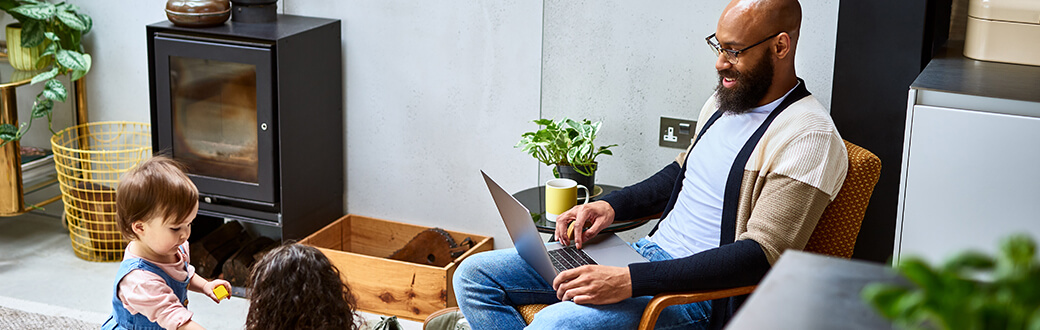 A man with his family, working from home.