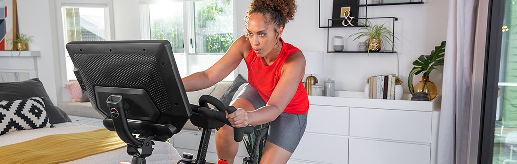 A person on a Bowflex VeloCore Bike.